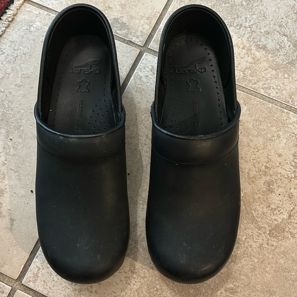 Dansko black leather clogs